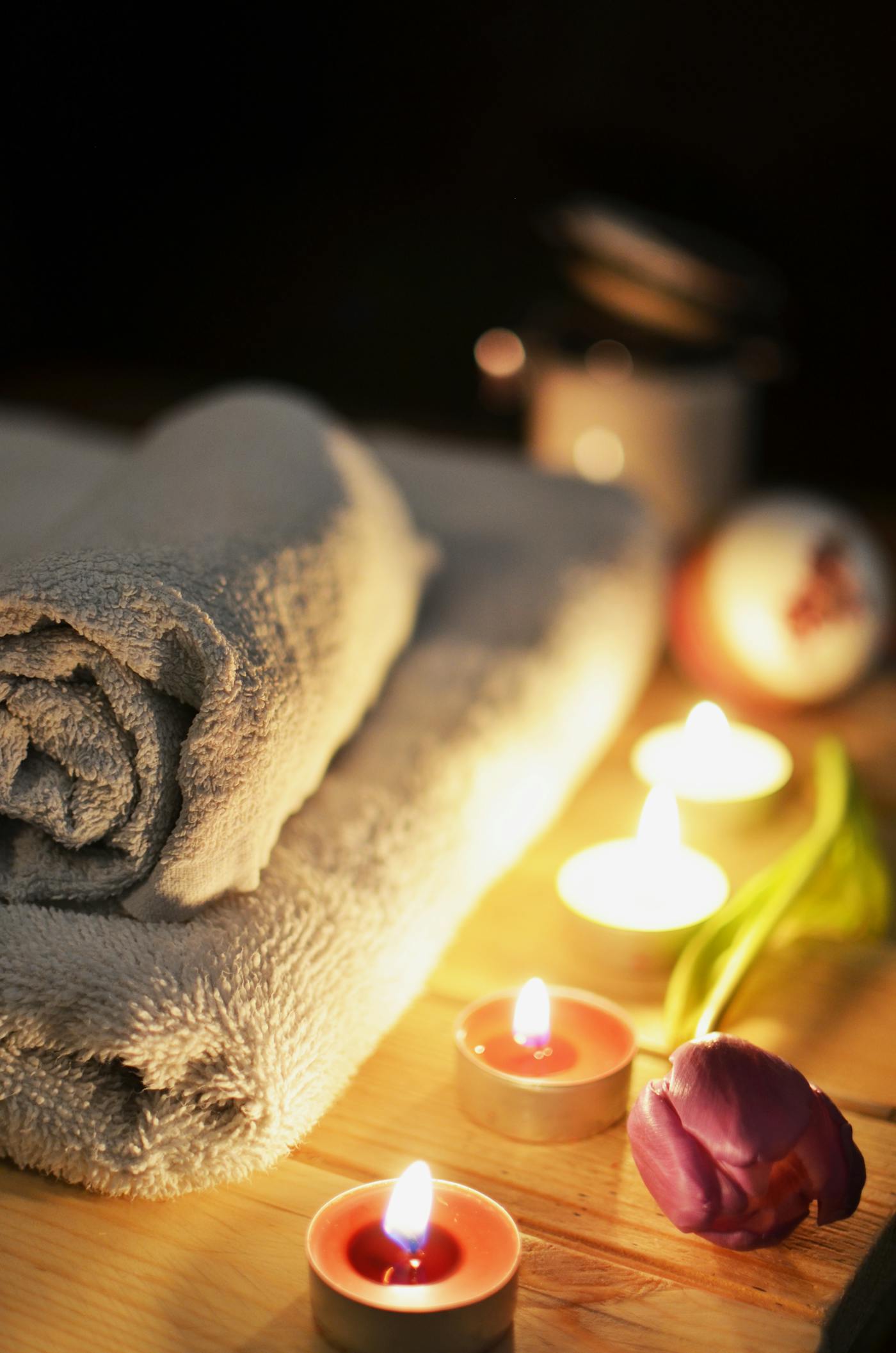 Spa towels and candlelight prepared for a quiet ritual