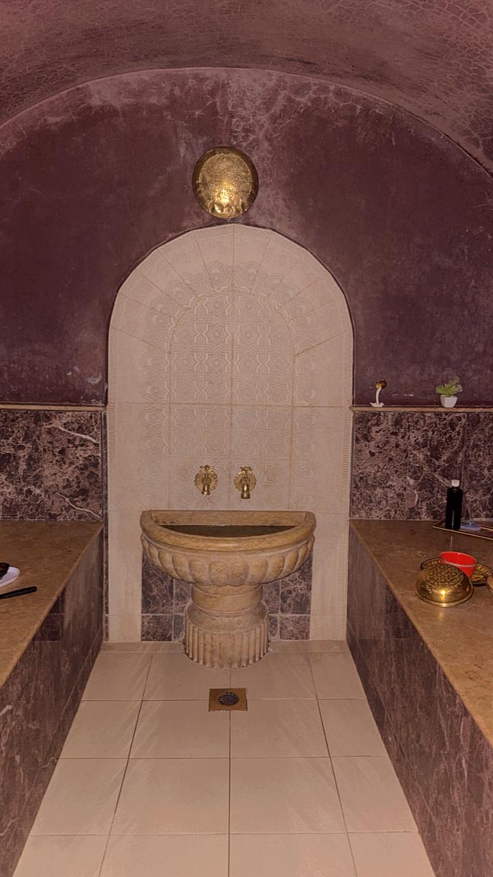 Traditional Moroccan hammam ritual room with candles