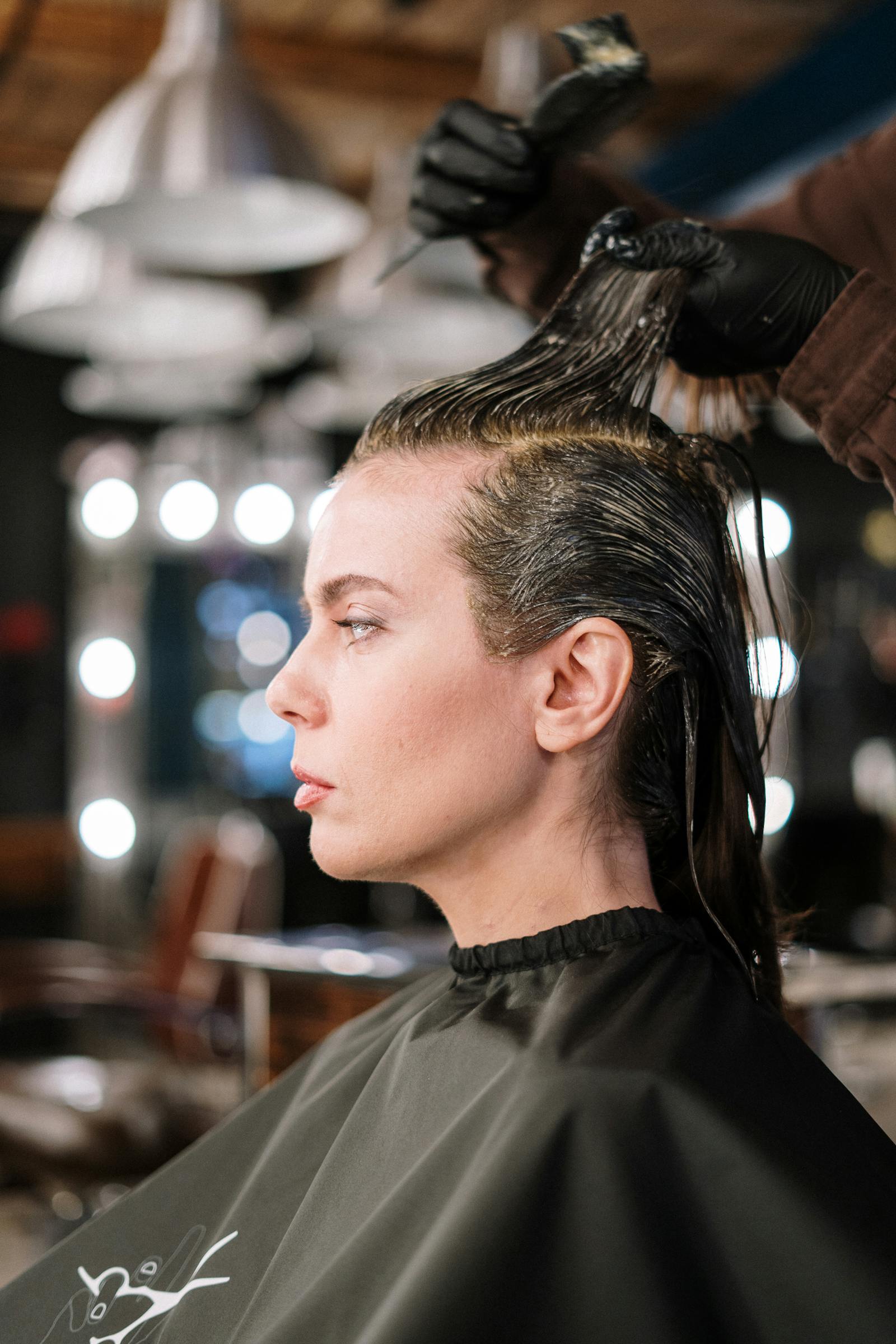 Professional hair color application in a salon