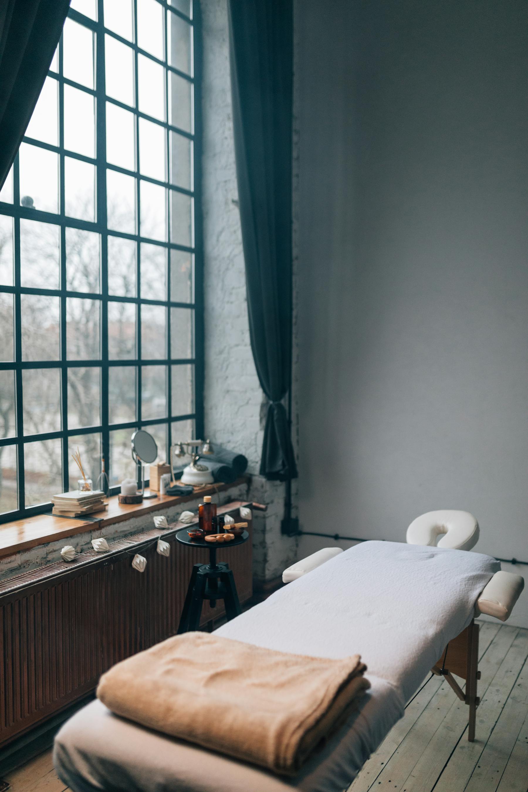 Elegant spa treatment room with soft natural light